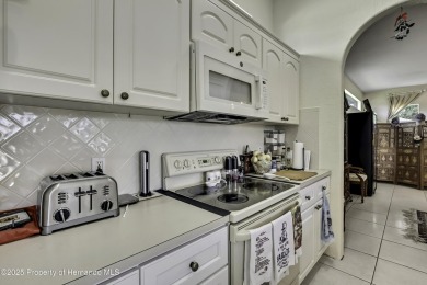 Looking for a place with a tropical vibe? Then come and on Glen Lakes Country Club in Florida - for sale on GolfHomes.com, golf home, golf lot