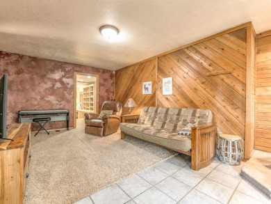 Tucked away amid whispering pines and just a short walk to the on Angel Fire Resort Country Club in New Mexico - for sale on GolfHomes.com, golf home, golf lot