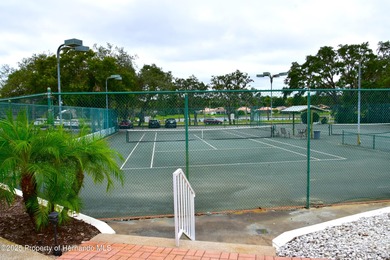 Escape the cold and enjoy yearround Florida sunshine in this on Glen Lakes Country Club in Florida - for sale on GolfHomes.com, golf home, golf lot