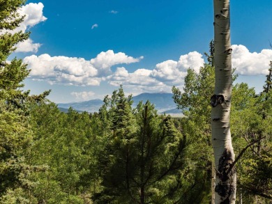 Tucked away amid whispering pines and just a short walk to the on Angel Fire Resort Country Club in New Mexico - for sale on GolfHomes.com, golf home, golf lot