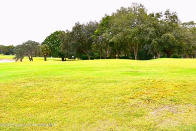 Escape the cold and enjoy yearround Florida sunshine in this on Glen Lakes Country Club in Florida - for sale on GolfHomes.com, golf home, golf lot