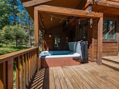 Tucked away amid whispering pines and just a short walk to the on Angel Fire Resort Country Club in New Mexico - for sale on GolfHomes.com, golf home, golf lot