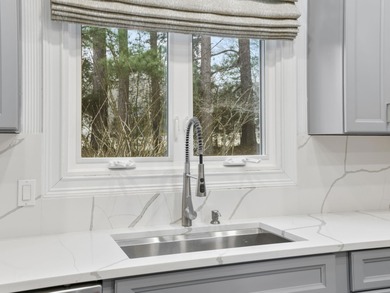 Experience country club living at its finest in this stunning on The Carolina Country Club in South Carolina - for sale on GolfHomes.com, golf home, golf lot