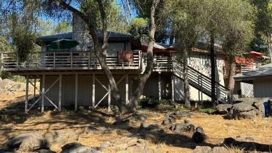 Sit back on your deck, high in the trees overlooking the golf on Yosemite Lakes Park Golf Course in California - for sale on GolfHomes.com, golf home, golf lot