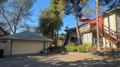 Sit back on your deck, high in the trees overlooking the golf on Yosemite Lakes Park Golf Course in California - for sale on GolfHomes.com, golf home, golf lot