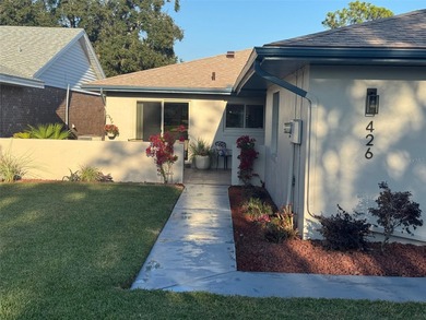 Located on a cul-de-sac, this 2 bedroom home overlooks a on Cypresswood Golf and Country Club in Florida - for sale on GolfHomes.com, golf home, golf lot