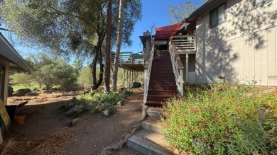 Sit back on your deck, high in the trees overlooking the golf on Yosemite Lakes Park Golf Course in California - for sale on GolfHomes.com, golf home, golf lot