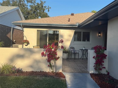 Located on a cul-de-sac, this 2 bedroom home overlooks a on Cypresswood Golf and Country Club in Florida - for sale on GolfHomes.com, golf home, golf lot