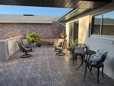 Located on a cul-de-sac, this 2 bedroom home overlooks a on Cypresswood Golf and Country Club in Florida - for sale on GolfHomes.com, golf home, golf lot