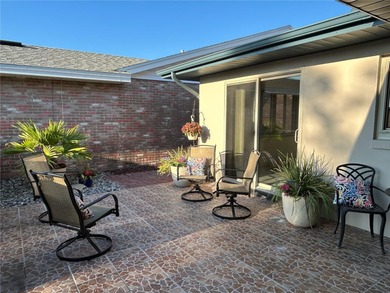 Located on a cul-de-sac, this 2 bedroom home overlooks a on Cypresswood Golf and Country Club in Florida - for sale on GolfHomes.com, golf home, golf lot