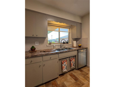 Located on a cul-de-sac, this 2 bedroom home overlooks a on Cypresswood Golf and Country Club in Florida - for sale on GolfHomes.com, golf home, golf lot