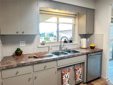 Located on a cul-de-sac, this 2 bedroom home overlooks a on Cypresswood Golf and Country Club in Florida - for sale on GolfHomes.com, golf home, golf lot