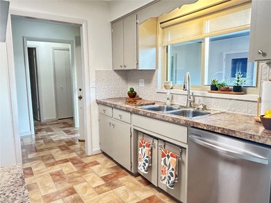 Located on a cul-de-sac, this 2 bedroom home overlooks a on Cypresswood Golf and Country Club in Florida - for sale on GolfHomes.com, golf home, golf lot