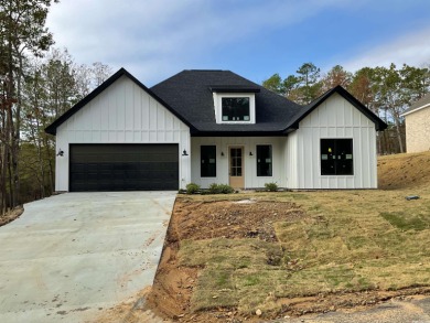 Four seasons of fun in this new build overlooking the 6th green on Diamondhead Golf and Country Club in Arkansas - for sale on GolfHomes.com, golf home, golf lot