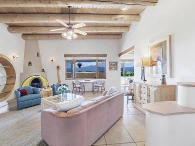 This exceptional adobe-style home, with a stucco exterior and on Taos Country Club in New Mexico - for sale on GolfHomes.com, golf home, golf lot