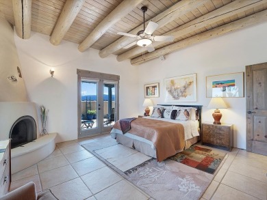 This exceptional adobe-style home, with a stucco exterior and on Taos Country Club in New Mexico - for sale on GolfHomes.com, golf home, golf lot