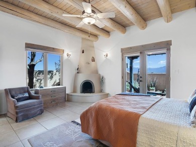This exceptional adobe-style home, with a stucco exterior and on Taos Country Club in New Mexico - for sale on GolfHomes.com, golf home, golf lot