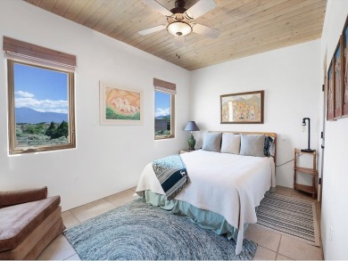 This exceptional adobe-style home, with a stucco exterior and on Taos Country Club in New Mexico - for sale on GolfHomes.com, golf home, golf lot