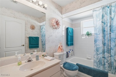 From the moment you step inside, cathedral ceilings fill the on Sabal Springs Golf and Racquet Club in Florida - for sale on GolfHomes.com, golf home, golf lot