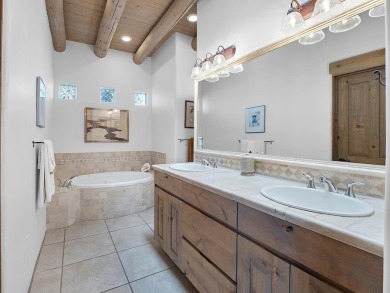 This exceptional adobe-style home, with a stucco exterior and on Taos Country Club in New Mexico - for sale on GolfHomes.com, golf home, golf lot