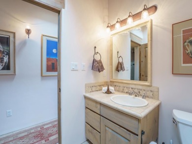 This exceptional adobe-style home, with a stucco exterior and on Taos Country Club in New Mexico - for sale on GolfHomes.com, golf home, golf lot