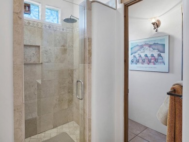 This exceptional adobe-style home, with a stucco exterior and on Taos Country Club in New Mexico - for sale on GolfHomes.com, golf home, golf lot