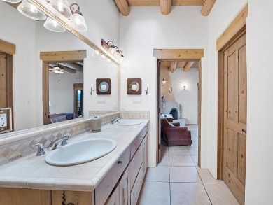 This exceptional adobe-style home, with a stucco exterior and on Taos Country Club in New Mexico - for sale on GolfHomes.com, golf home, golf lot