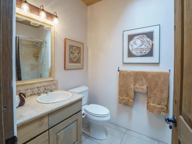 This exceptional adobe-style home, with a stucco exterior and on Taos Country Club in New Mexico - for sale on GolfHomes.com, golf home, golf lot