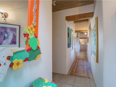 This exceptional adobe-style home, with a stucco exterior and on Taos Country Club in New Mexico - for sale on GolfHomes.com, golf home, golf lot