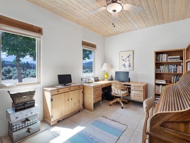 This exceptional adobe-style home, with a stucco exterior and on Taos Country Club in New Mexico - for sale on GolfHomes.com, golf home, golf lot