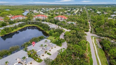 Spacious second-floor coach home is now available in Pelican on Pelican Sound Golf and River Club in Florida - for sale on GolfHomes.com, golf home, golf lot