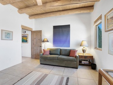 This exceptional adobe-style home, with a stucco exterior and on Taos Country Club in New Mexico - for sale on GolfHomes.com, golf home, golf lot