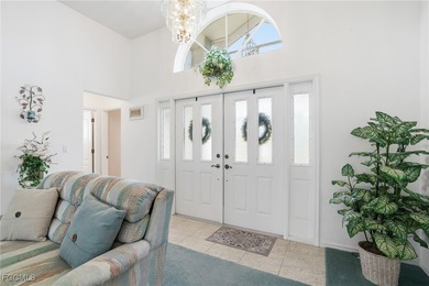 From the moment you step inside, cathedral ceilings fill the on Sabal Springs Golf and Racquet Club in Florida - for sale on GolfHomes.com, golf home, golf lot