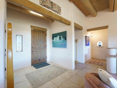 This exceptional adobe-style home, with a stucco exterior and on Taos Country Club in New Mexico - for sale on GolfHomes.com, golf home, golf lot