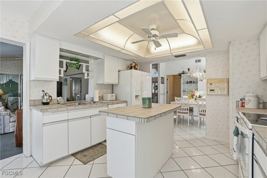 From the moment you step inside, cathedral ceilings fill the on Sabal Springs Golf and Racquet Club in Florida - for sale on GolfHomes.com, golf home, golf lot