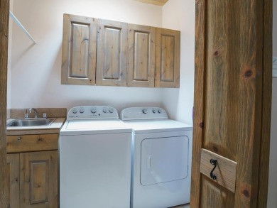 This exceptional adobe-style home, with a stucco exterior and on Taos Country Club in New Mexico - for sale on GolfHomes.com, golf home, golf lot