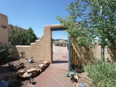 This exceptional adobe-style home, with a stucco exterior and on Taos Country Club in New Mexico - for sale on GolfHomes.com, golf home, golf lot