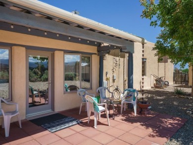 This exceptional adobe-style home, with a stucco exterior and on Taos Country Club in New Mexico - for sale on GolfHomes.com, golf home, golf lot