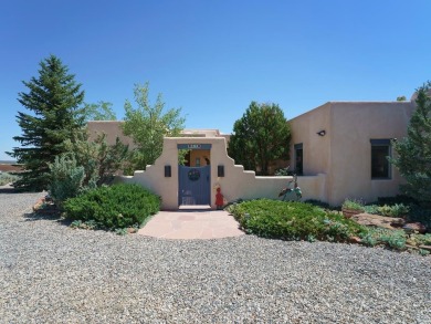 This exceptional adobe-style home, with a stucco exterior and on Taos Country Club in New Mexico - for sale on GolfHomes.com, golf home, golf lot