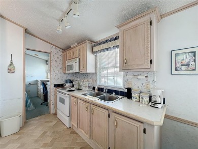 **For Sale: Charming Furnished Single Wide Home in a Vibrant 55+ on Lily Lake Golf and RV Resort in Florida - for sale on GolfHomes.com, golf home, golf lot