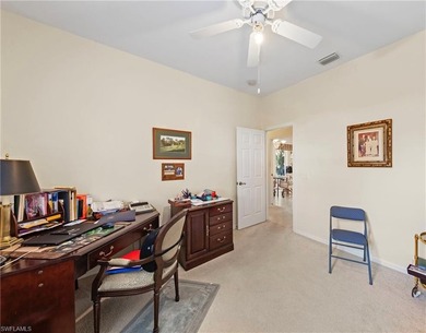 This four-bedroom, three-bathroom home is located within the on Fiddlesticks Country Club in Florida - for sale on GolfHomes.com, golf home, golf lot