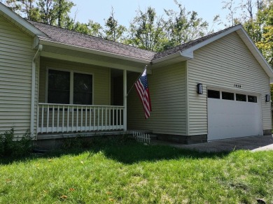 This low-maintenance 3-bedroom, 2-bath home features a bright on Michaywe Pines Course in Michigan - for sale on GolfHomes.com, golf home, golf lot