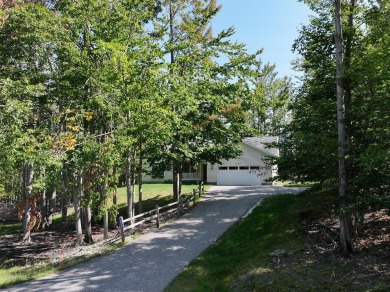 This low-maintenance 3-bedroom, 2-bath home features a bright on Michaywe Pines Course in Michigan - for sale on GolfHomes.com, golf home, golf lot