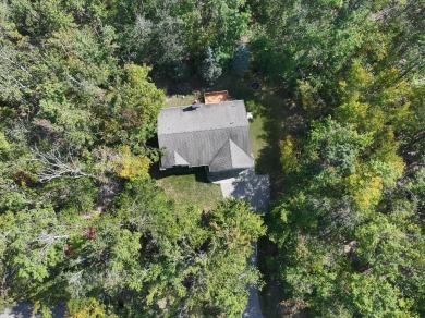 This low-maintenance 3-bedroom, 2-bath home features a bright on Michaywe Pines Course in Michigan - for sale on GolfHomes.com, golf home, golf lot