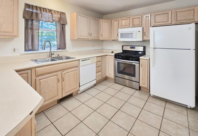 This low-maintenance 3-bedroom, 2-bath home features a bright on Michaywe Pines Course in Michigan - for sale on GolfHomes.com, golf home, golf lot