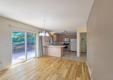 This low-maintenance 3-bedroom, 2-bath home features a bright on Michaywe Pines Course in Michigan - for sale on GolfHomes.com, golf home, golf lot