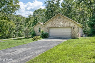 Brick Basement Ranch with two car garage on main level and on Lake Tansi Village Country Club in Tennessee - for sale on GolfHomes.com, golf home, golf lot