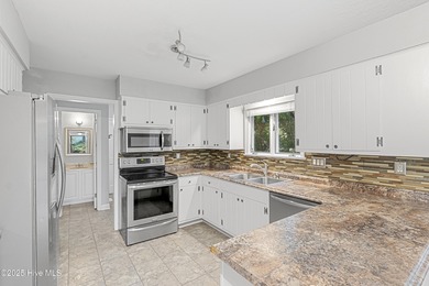 Golf Front Home in the Heart of Whispering Pines. Overlooking on Whispering Pines Golf Course in North Carolina - for sale on GolfHomes.com, golf home, golf lot