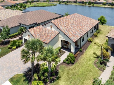 Experience casual lakefront luxury in this stunning residence on Boca Royale Golf and Country Club in Florida - for sale on GolfHomes.com, golf home, golf lot