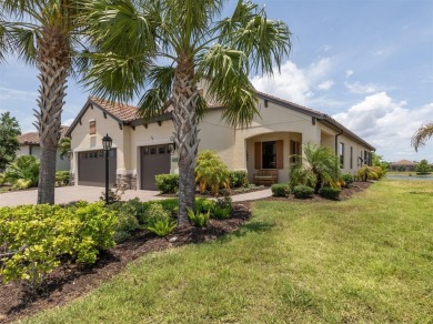 Experience casual lakefront luxury in this stunning residence on Boca Royale Golf and Country Club in Florida - for sale on GolfHomes.com, golf home, golf lot